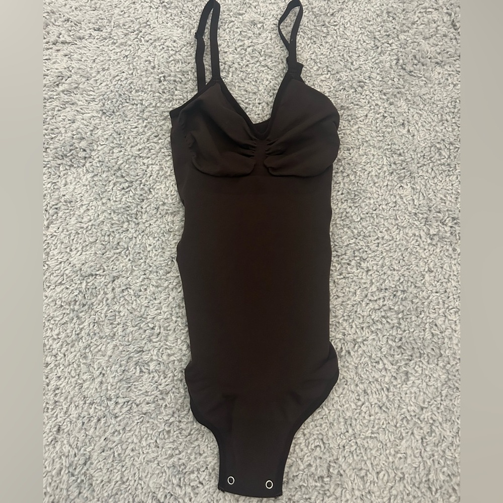 brown bodysuit